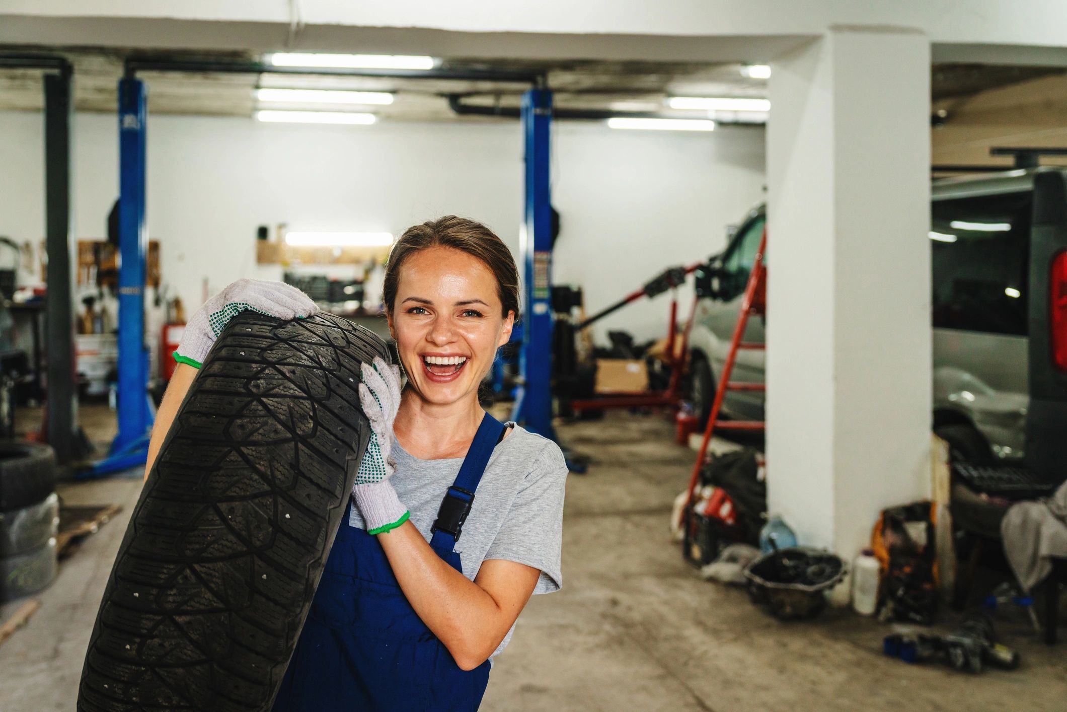 Mechanic performing vehicle wheel and brake service
